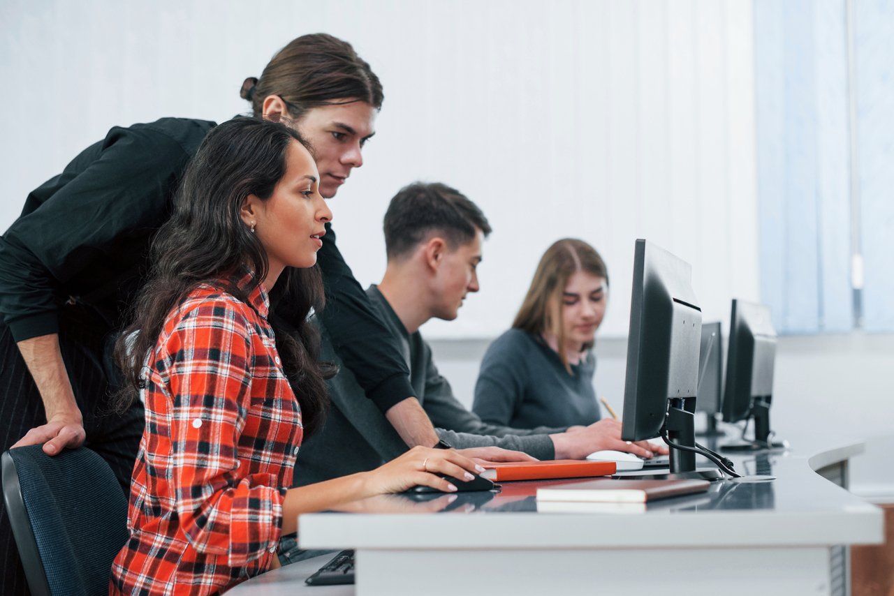 Students working together on computers at JTech and PEF Institute